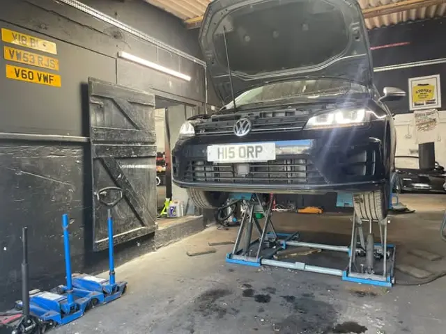 Volkswagen raised on a lift inside the Tyland Lane workshop