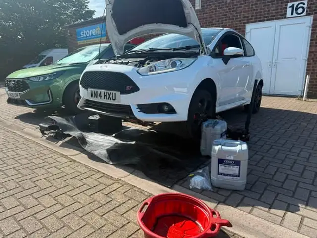 White Ford Fiesta ST on stands for an oil service